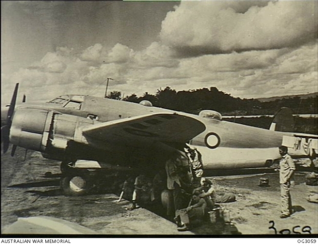 Aircrew and servicing personnel who travelled on the Lockheed Lodestar aircraft of No. 37 Squadron RAAF which escorted the Supermarine Spitfire aircraft of No. 452 Squadron RAAF during the move from Sattler airfield, near Darwin, NT, to Morotai Island in the Halmahera Islands, Dutch East Indies. They are seen here at Merauke, Dutch New Guinea, the first stop on the long flight. [AWM OG3059]