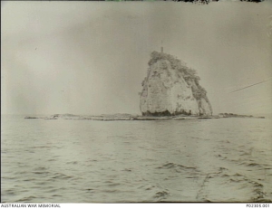 Cape Ward Hunt, Papua. 1944-05-20. Mitre Rock north of Cape Ward Hunt. The survey vessel HMAS Moresby was despatched to repair the navigation light that had recently been placed on top of Mitre Rock. A party from the Moresby repaired the light and the vessel remained at anchor overnight to ensure the light was operating.