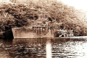 HMAS Whyalla in camouflage in New Guinea